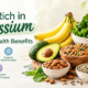 Food rich in potassium including bananas, avocado, spinach, leafy green vegetables, lentils, beans, potatoes, almonds, and seeds, highlighting their health benefits for heart health, muscle function, nerve function, fluid balance, and blood pressure.